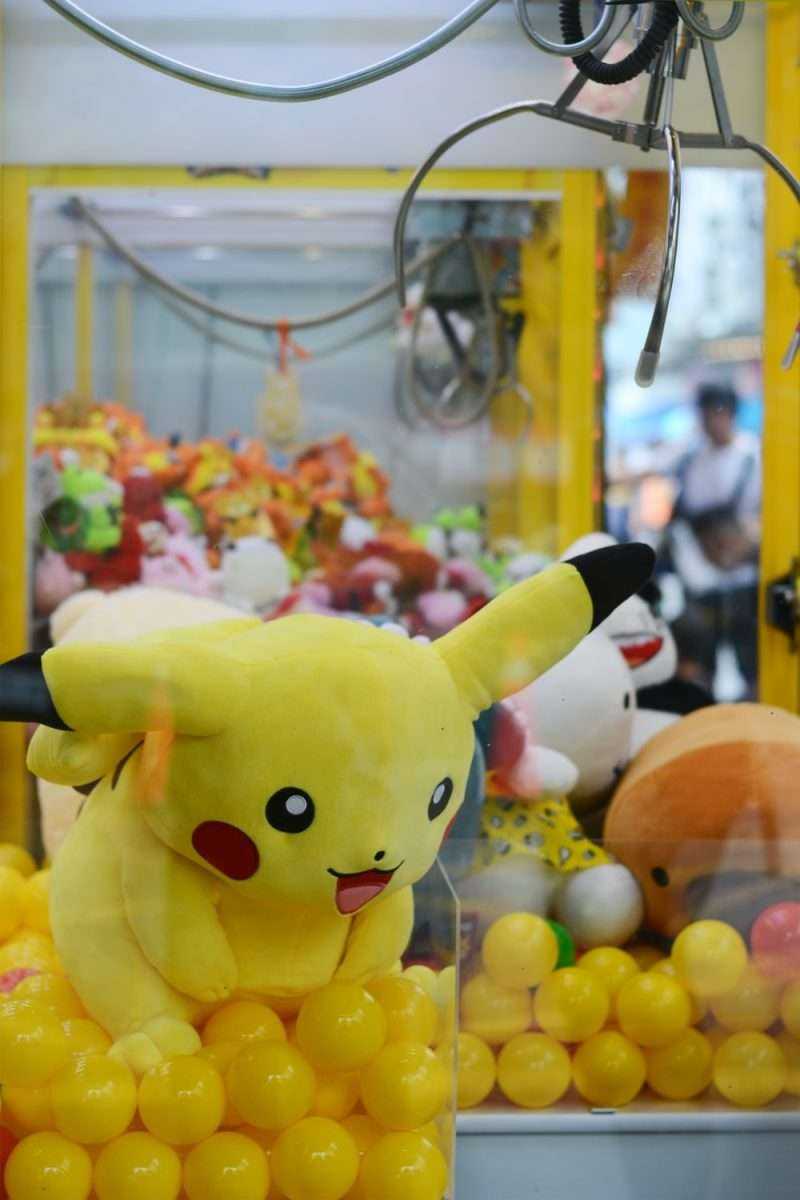 Pokemon Pikachu plush toy in claw machine photo  Free Human Image on ...